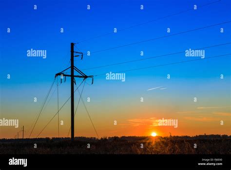 power line at sunset Stock Photo - Alamy