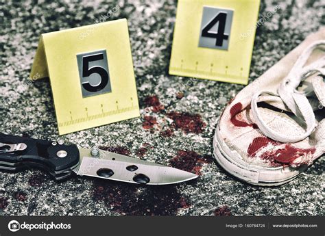 Crime scene investigation, Bloody knife and victim's shoes with ...