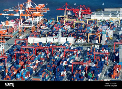 Osaka sea port at Osaka Bay, aerial view of cranes and containers ...