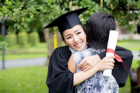 Young Female Graduate Hugging Her Friend at Graduation Ceremony Stock Image - Image of diploma ...