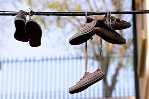 Shoes Hanging From Power Lines Stock Photos, Pictures & Royalty-Free ...