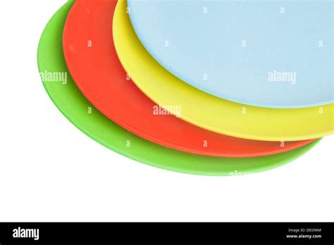 Pile of colorful dishes isolated on white Stock Photo - Alamy