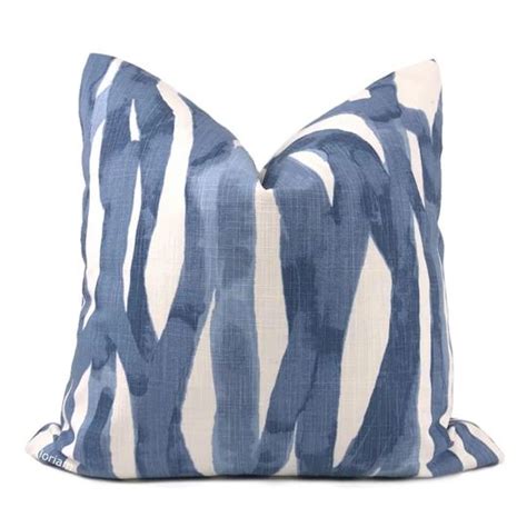 a blue and white striped pillow on a white background