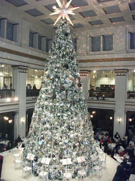 a large christmas tree in the middle of a building