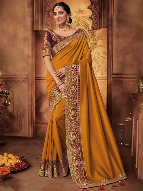 Mustard Silk Plain Saree with Peacock Motif Embroidered Border in 2020 | Traditional sarees ...