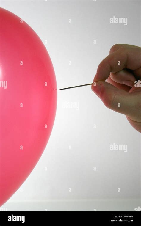 balloon with needle Stock Photo - Alamy