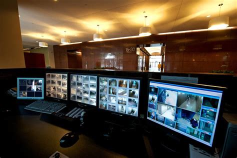 Security Monitors in Office Building | Security room, Business security ...