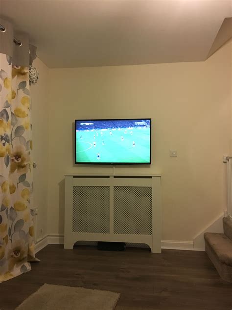 Work in progress. My wall mounted tv above a radiator. I just need something for above the tv ...
