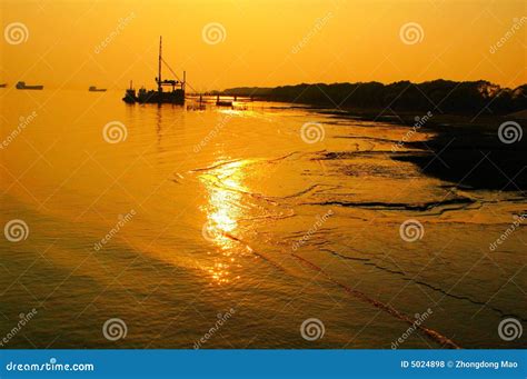 Golden sunset over water stock photo. Image of colourful - 5024898