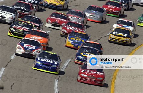 Race winner Dale Earnhardt Jr (USA) Budweiser Chevrolet (Right) leads the field. NASCAR Winston ...