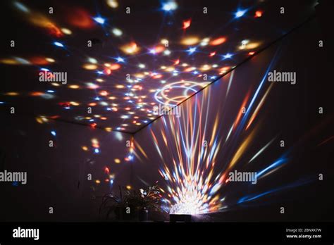 photo of a disco light in a house party Stock Photo - Alamy