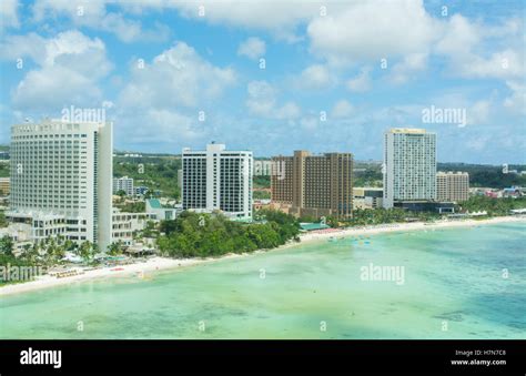 Guam USA Territory Tumon Bay hotels and beach from above with ocean beach and clouds Stock Photo ...