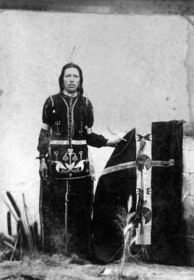 studio portrait of an unidentified Native American (Great Plains) man. He may be Ponca ...