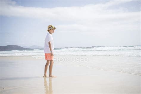 Boy standing on beach — carefree, Canary Islands - Stock Photo | #146971749