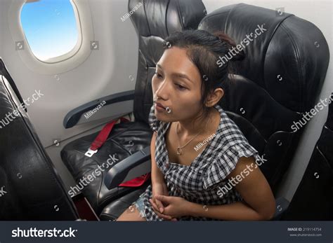 Asian Girl Sitting On Plane Passenger Stock Photo 219114754 | Shutterstock