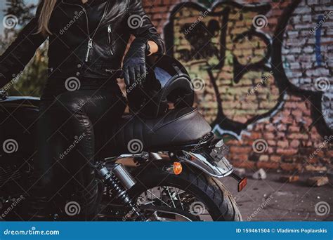 Female Biker in Black with Her Motorbike Next To Graffity Wall Stock Photo - Image of middle ...