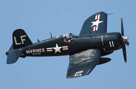 A restored F4U-4 Corsair in Korean War-era U.S. Marine Corps markings ...