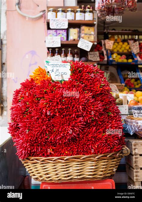 Huge basket of chili on display at the front of a store by Rialto Market in Venice, Italy Stock ...