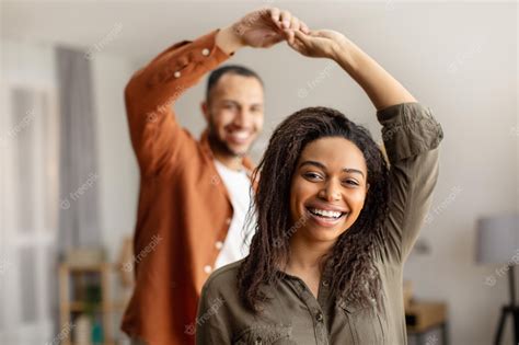 Premium Photo | Cheerful african american couple dancing having fun at home