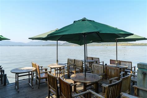 Premium Photo | Outdoor restaurant on the shore of west lake