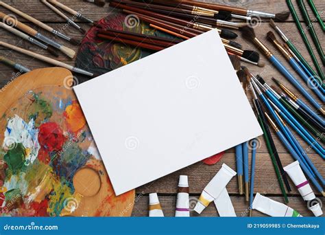 Blank Canvas, Brushes, Palettes and Paints on Wooden Table, Flat Lay ...