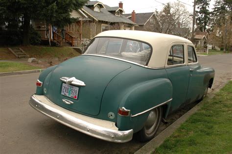 OLD PARKED CARS.: 1952 Plymouth Cranbrook.