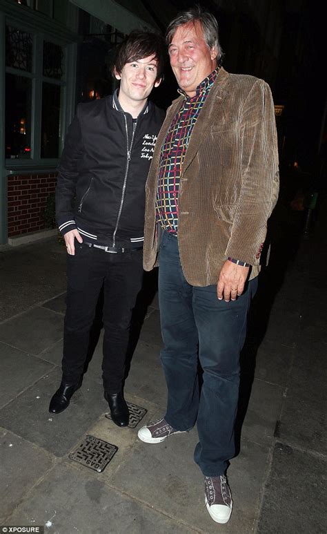 Comedian Stephen Fry, 57, is loved up with husband Elliott Spencer, 27 ...