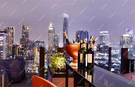 Premium Photo | Bangkok city view point from rooftop bar, overlooking a magnificent cityscape ...