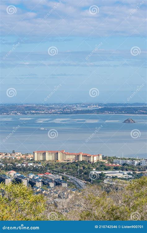 Aerial View of the Xiamen City Skyline and Mountains beside the Beach, and Jinmen Kinmen Island ...