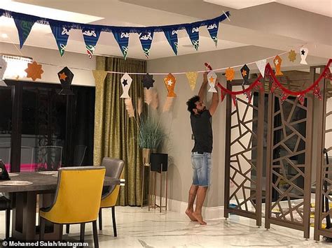 Mohamed Salah hangs up decorations in his house as Liverpool star marks ...