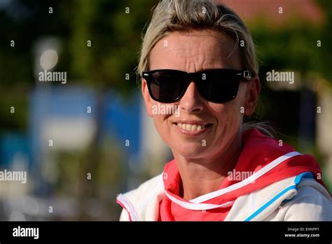 Woman with sunglasses smiles Stock Photo - Alamy