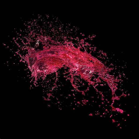 Red Water Splash On Black Background by Biwa Studio