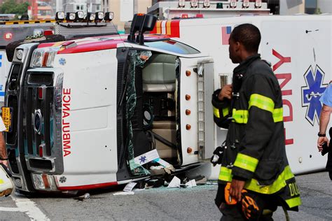 2 EMTs injured after accident causes ambulance to overturn