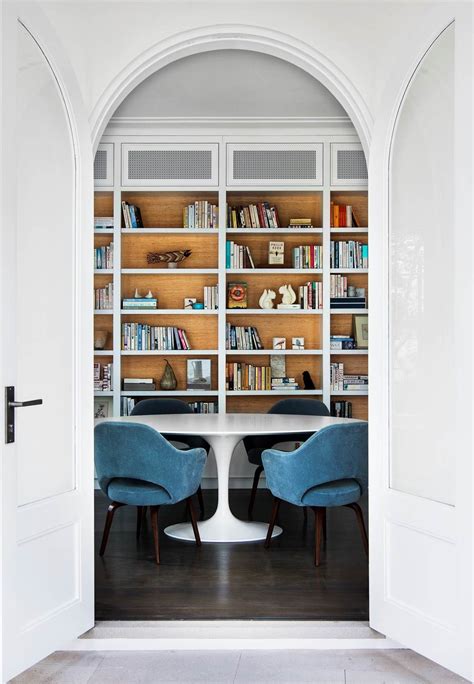 An elegant archway frames the ultra-luxe home library in this Sydney home designed by Robert ...