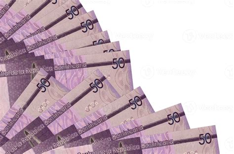 50 Dominican pesos bills lies isolated on white background with copy space stacked in fan close ...