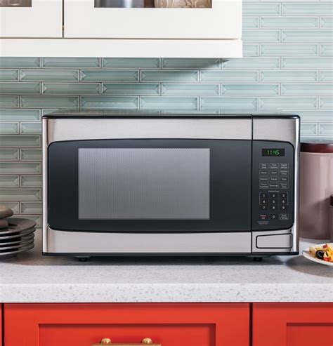 GE JESP113SPSS 21 Inch Countertop Microwave Oven with 1.1 Cu. Ft. Capacity, Instant On Controls ...