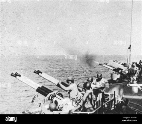 USS Quincy (CA-71) firing 40 mm guns in July 1952 Stock Photo - Alamy