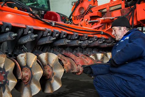 Mechanic Repairs Agricultural Machinery. Preparation of Equipment for ...