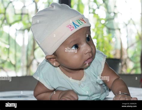 Cute baby hold his head up. Closeup portrait. Happy baby boy smiling ...