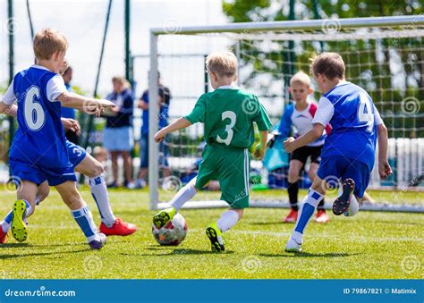 School Kids Playing Soccer