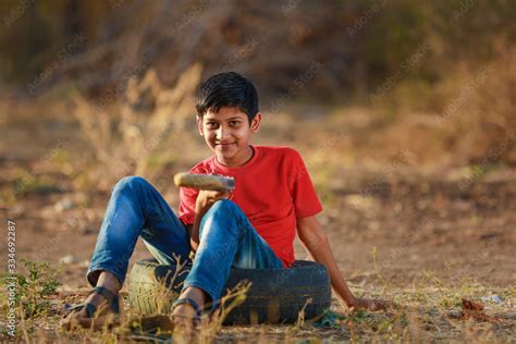 Rural Indian Child Playing Cricket Stock Photo | Adobe Stock