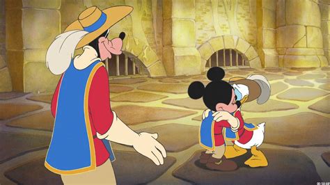 Musketeer Donald hugs Mickey as Goofy looks on in the 2004 movie: "The ...