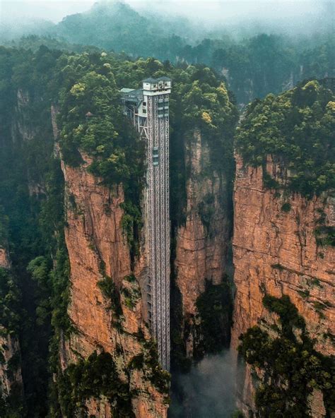 Located in Zhangjiajie City, China, the Zhangjiajie National Forest Park's towering Bailong ...