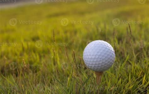 Golf ball on green grass background 823307 Stock Photo at Vecteezy