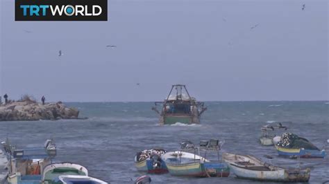 Gaza fishermen struggle to earn their catch - YouTube