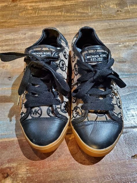 Awesome MK Sneakers with Signature Logo. In good condition with some ...