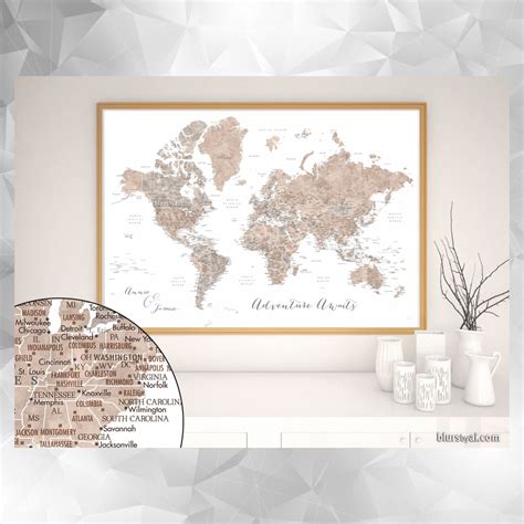 a framed world map hanging on a wall next to two vases and a potted plant