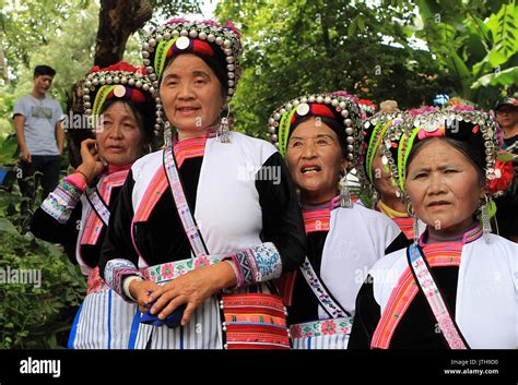 Mile, China's Yunnan Province. 9th Aug, 2017. People of Yi ethnic group watch performances ...