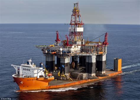 That's a load of ships! The carrier boat that can hold up to 22 barges - and even an oil rig ...