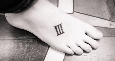 Roman Numeral 3 Tattoo On Ribs